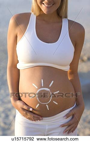Stock Image - Sun protection during pregnancy. Fotosearch