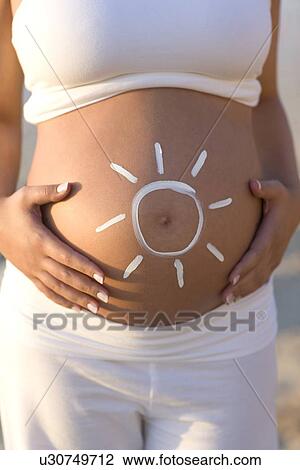 Stock Image - Sun protection during pregnancy. Fotosearch