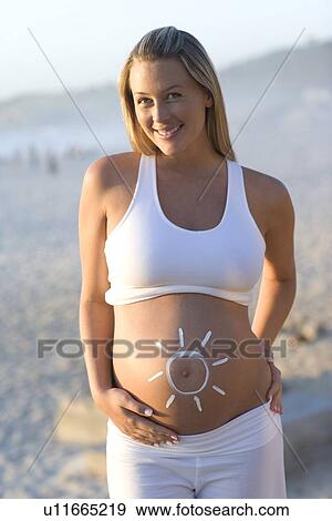Stock Photo - Sun protection during pregnancy. Fotosearch