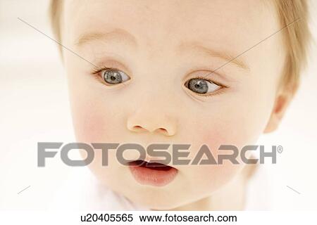 Stock Photography - Surprised baby boy. Fotosearch