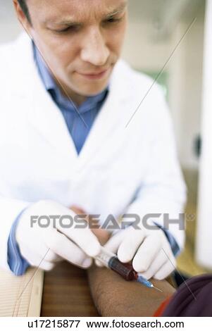 Taking blood View Large Photo Image Stock Photo - Taking blood. Fotosearch