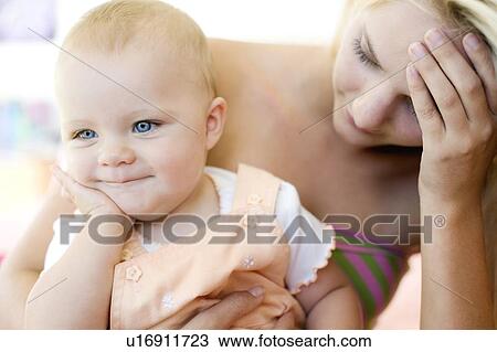 Stock Image - Teenage mother and baby. Fotosearch