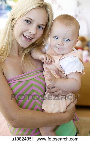 Stock Image - Teenage mother and baby. Fotosearch