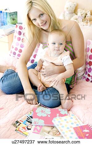 Teenage mother and baby View Large Photo Image Stock Photo - Teenage mother and baby. Fotosearch