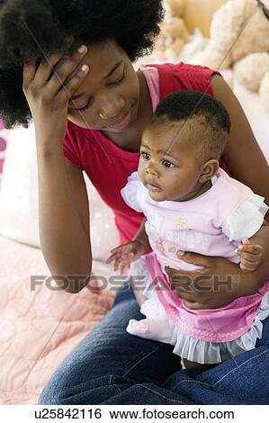 Stock Photograph - Teenage mother and baby. Fotosearch