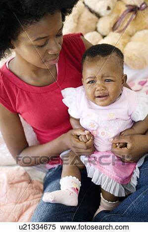 Teenage mother and baby View Large Photo Image Stock Photography - Teenage mother and baby. Fotosearch