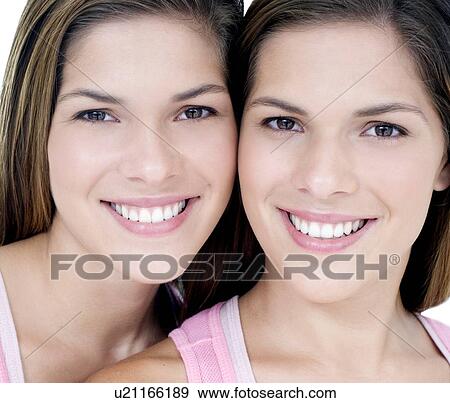 Stock Photo - Teenage twin sisters. Fotosearch