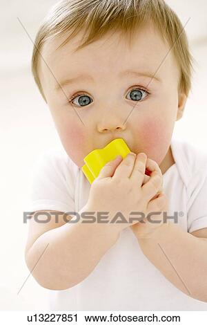 Stock Image - Teething baby. Fotosearch