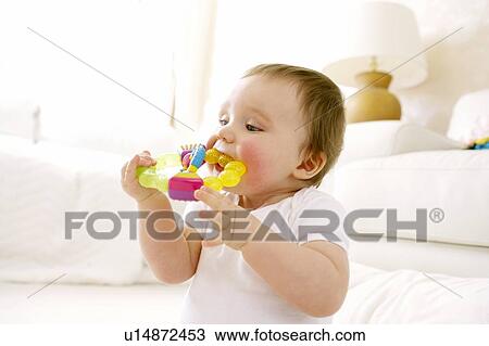 Teething baby View Large Photo Image Stock Image - Teething baby. Fotosearch