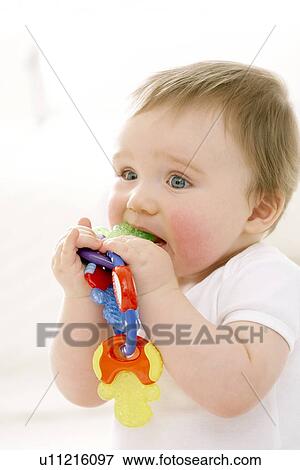Teething baby View Large Photo Image Stock Photo - Teething baby. Fotosearch