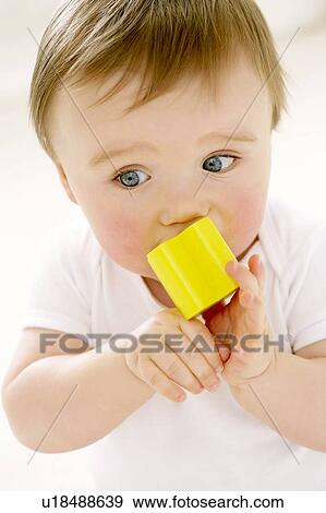 Teething baby View Large Photo Image Stock Photo - Teething baby. Fotosearch