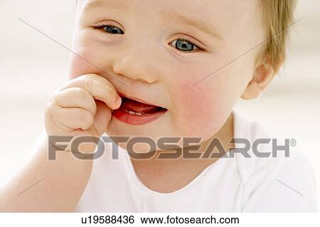 Stock Photograph - Teething baby. Fotosearch