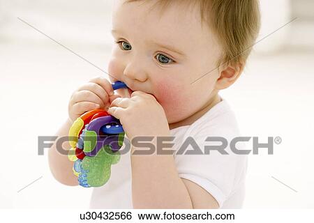 Stock Photograph - Teething baby. Fotosearch