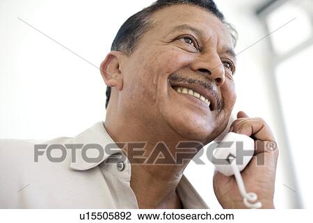 Stock Image - Telephone use. Fotosearch