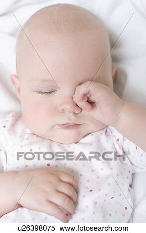 Stock Photography - Tired baby. Fotosearch