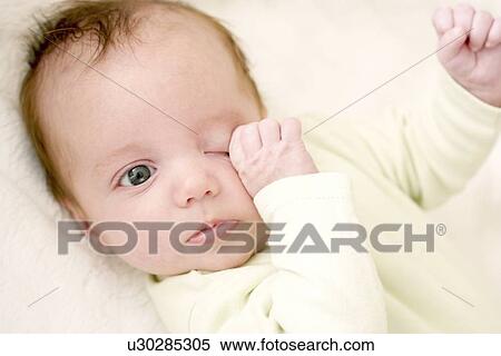 Stock Photography - Tired baby. Fotosearch