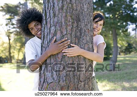 Tree hugging View Large Photo Image Picture - Tree hugging. Fotosearch