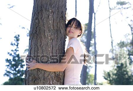 Tree hugging View Large Photo Image Stock Image - Tree hugging. Fotosearch