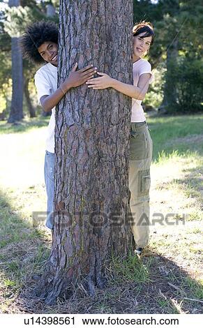 Tree hugging View Large Photo Image Stock Image - Tree hugging. Fotosearch