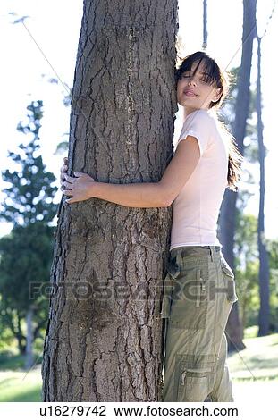 Tree hugging View Large Photo Image Stock Image - Tree hugging. Fotosearch