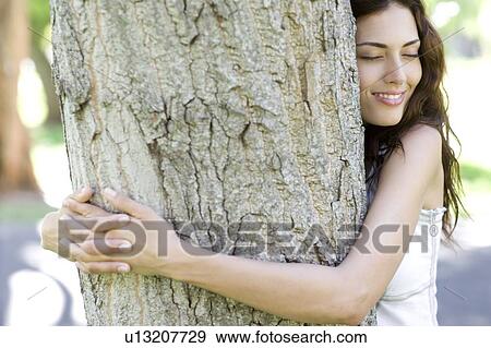 Tree hugging View Large Photo Image Stock Photo - Tree hugging. Fotosearch