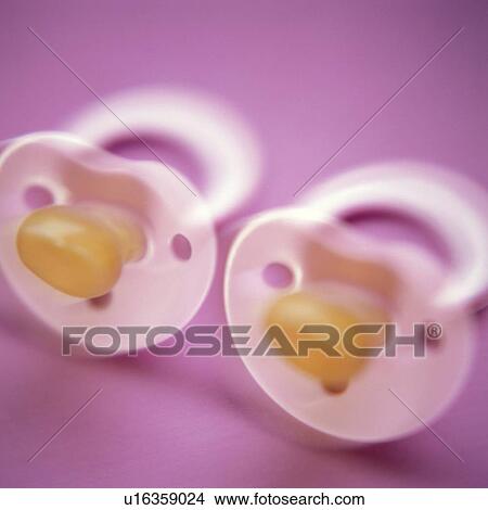 Picture - Twins' dummies. Fotosearch