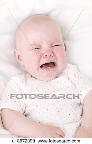 Stock Photo - Unhappy baby. Fotosearch