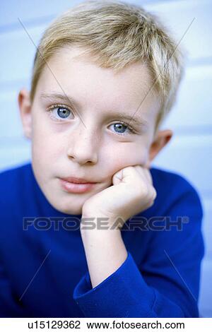 Stock Image - Unhappy boy. Fotosearch