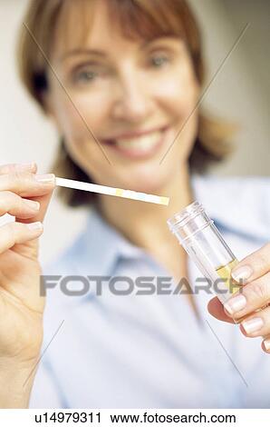 Stock Image - Urine analysis in pregnancy. Fotosearch