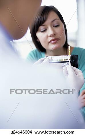 Picture - Urine analysis. Fotosearch