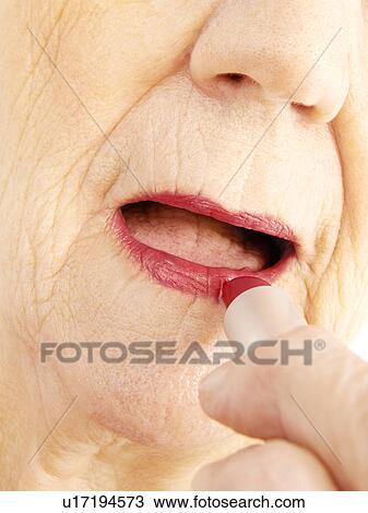 Wearing lipstick View Large Photo Image Stock Image - Wearing lipstick. Fotosearch