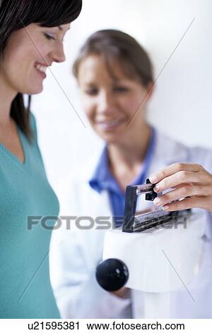 Stock Image - Weight check-up. Fotosearch