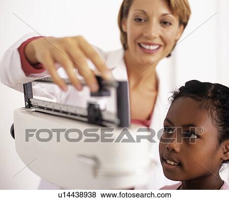 Stock Photo - Weight check-up. Fotosearch