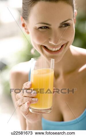 Woman drinking juice View Large Photo Image Stock Image - Woman drinking juice. Fotosearch
