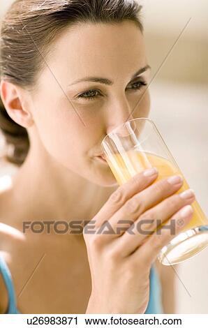 Woman drinking juice View Large Photo Image Stock Image - Woman drinking juice. Fotosearch