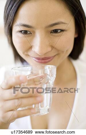 Woman drinking water View Large Photo Image Stock Photo - Woman drinking water. Fotosearch