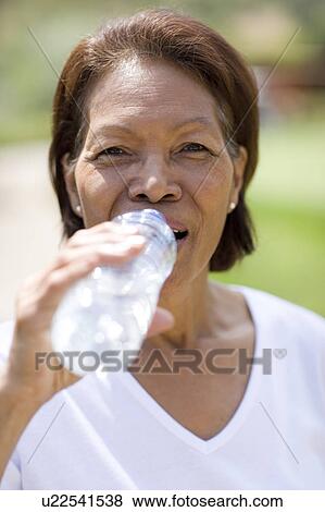 Stock Photo - Woman drinking water. Fotosearch
