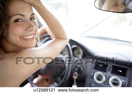 Woman driving View Large Photo Image Stock Image - Woman driving. Fotosearch