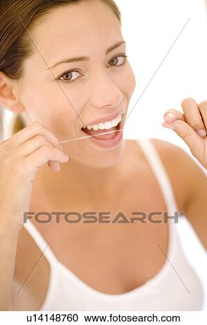 Woman flossing View Large Photo Image Stock Image - Woman flossing. Fotosearch