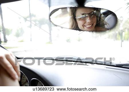 Woman in a car View Large Photo Image Stock Image - Woman in a car. Fotosearch