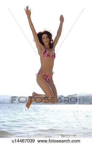 Woman jumping View Large Photo Image Stock Photo - Woman jumping. Fotosearch