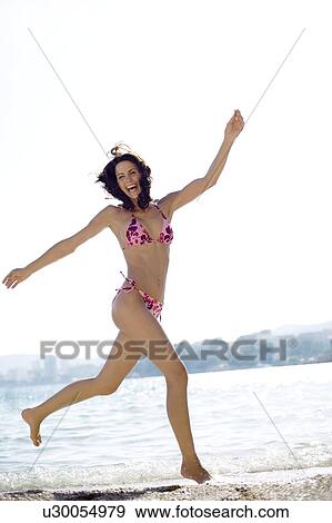 Stock Photo - Woman jumping. Fotosearch