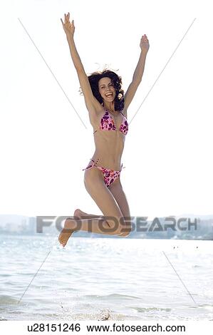 Woman jumping View Large Photo Image Stock Photograph - Woman jumping. Fotosearch