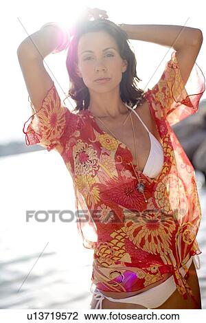 Stock Image - Woman on a beach. Fotosearch