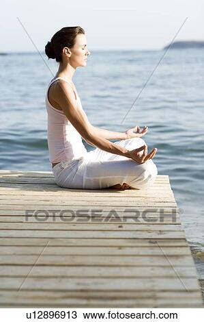 Woman performing yoga exercise View Large Photo Image Stock Image - Woman performing yoga exercise. Fotosearch