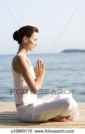 Woman performing yoga exercise View Large Photo Image Stock Image - Woman performing yoga exercise. Fotosearch