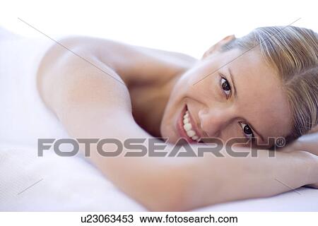 Stock Image - Woman relaxing at a spa. Fotosearch