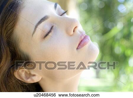 Woman resting outdoors View Large Photo Image Stock Photograph - Woman resting outdoors. Fotosearch