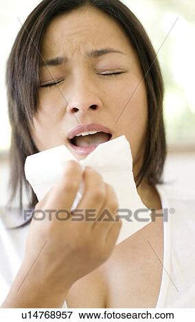 Stock Photo - Woman sneezing. Fotosearch
