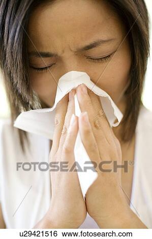Woman sneezing View Large Photo Image Stock Photograph - Woman sneezing. Fotosearch